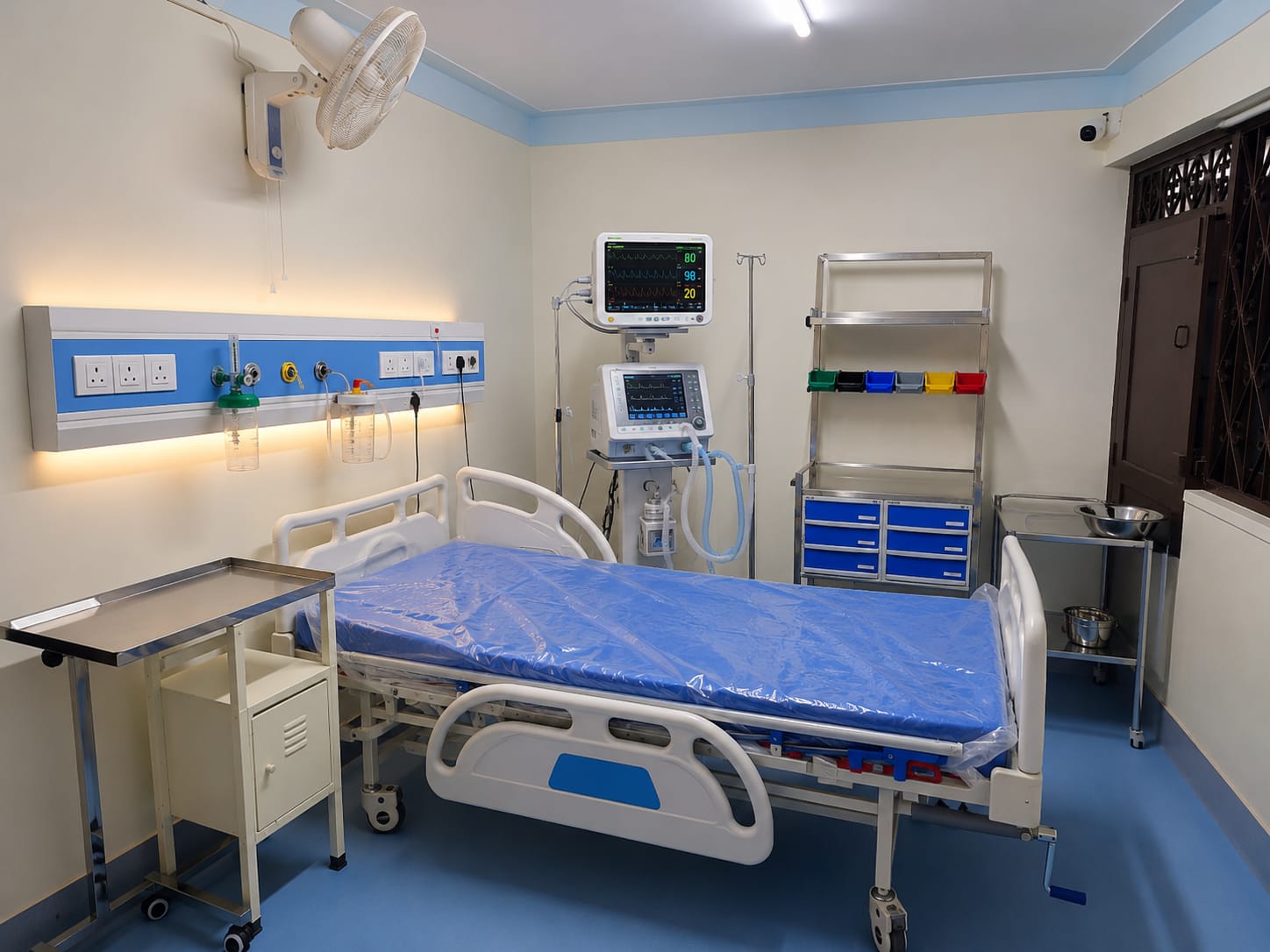 ANSTA intensive-care training room — hospital bed, patient monitor, ventilator and oxygen wall panel